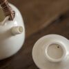 Rattan Handle Milky White Ceramic Kung Fu Teapot