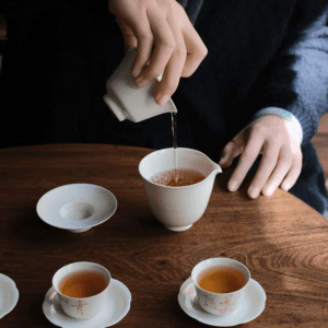 Pour tea out into fair cup from Gaiwan