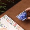 Fully Hand-painted Qinghua Ceramic Twined Lotus Two Lions 120ml Tea Cup