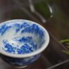 2784b804ad5ecb757c1c143a3da5365 Fully Handmade Ceramic Qinghua Mountain Tea Cup