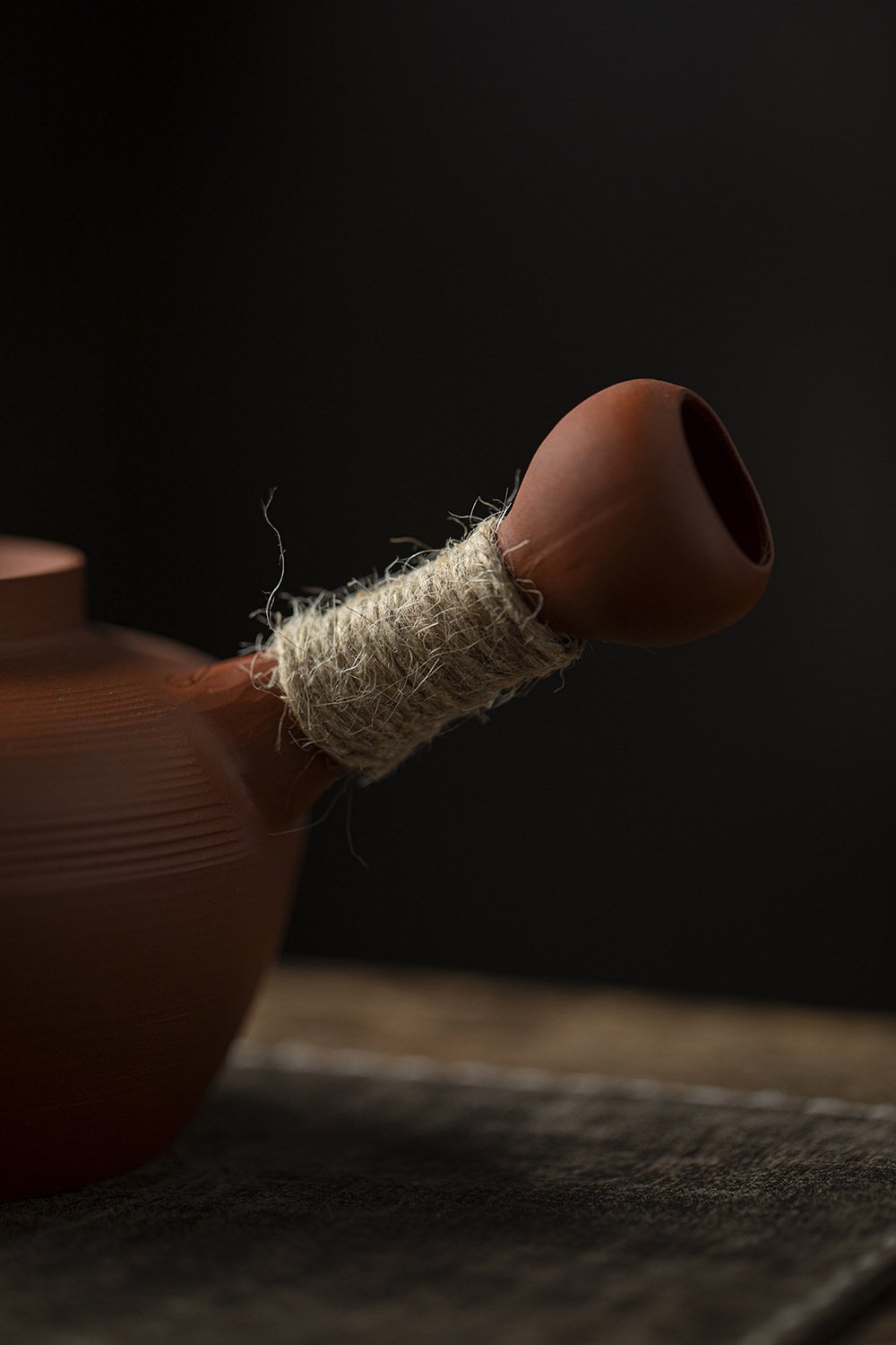 Traditional Chaozhou-style red clay charcoal stove and kettle used for heating water for gongfu tea