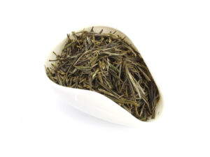 Chinese Huang Ya yellow tea leaves in a white tea presentation vessel.
